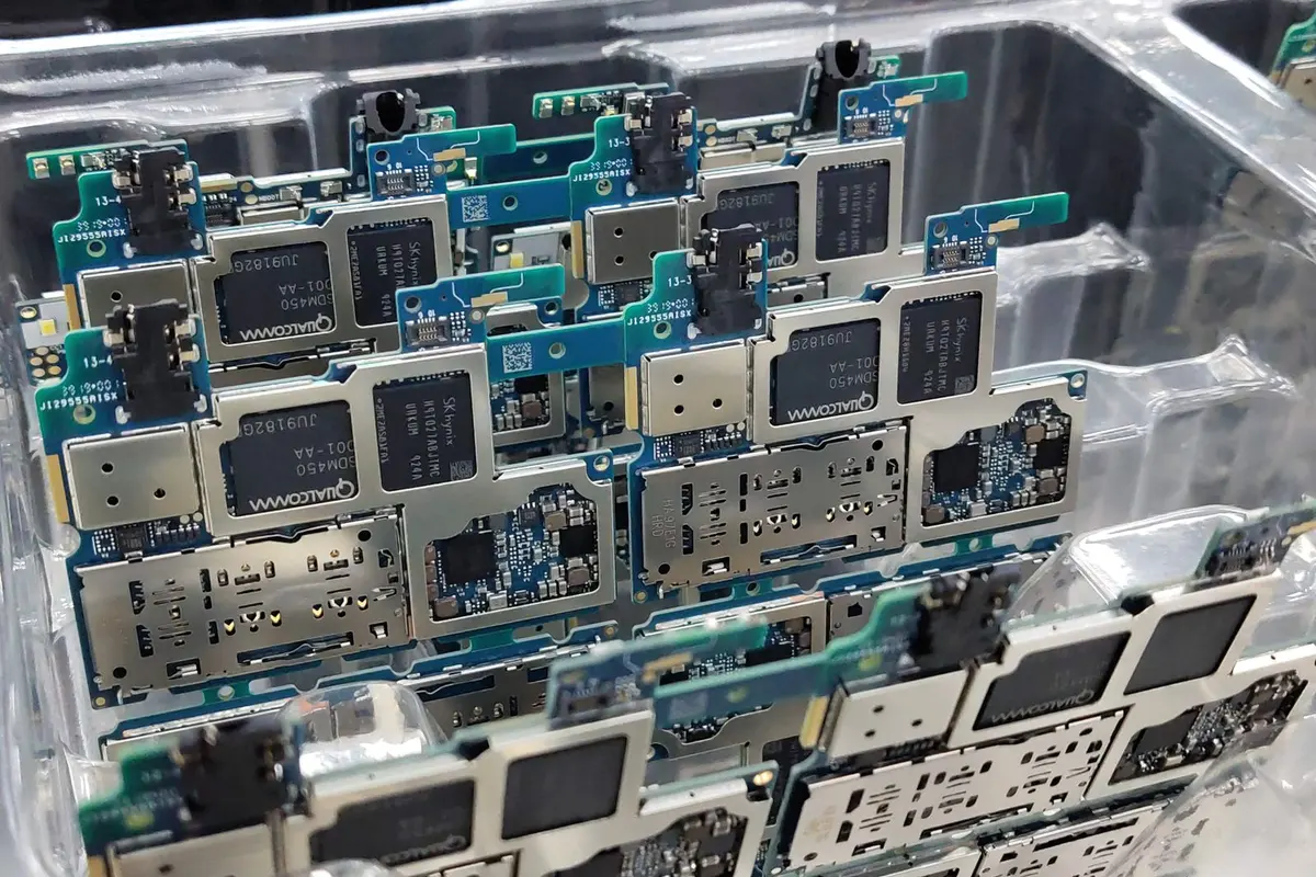Electronic circuit boards laid in a clear plastic tray at an assembly workshop