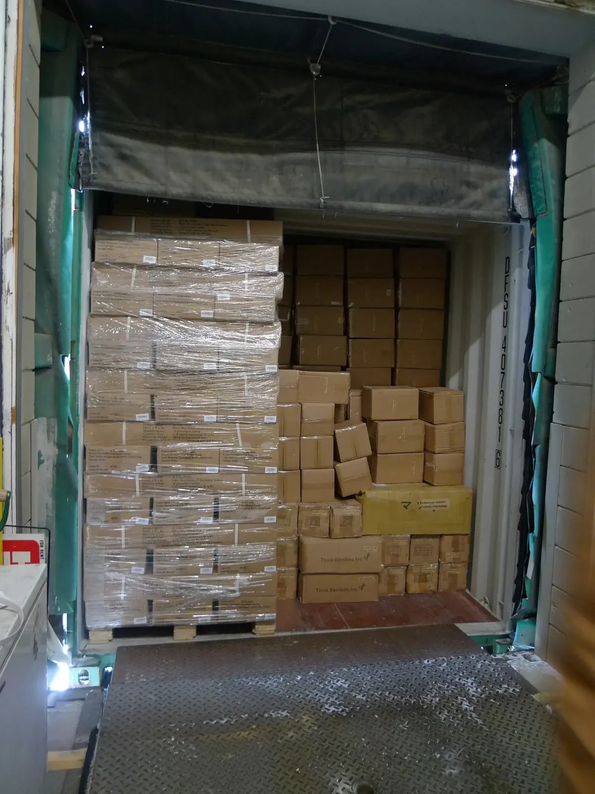 Cartons stacked on a container floor without a pallet