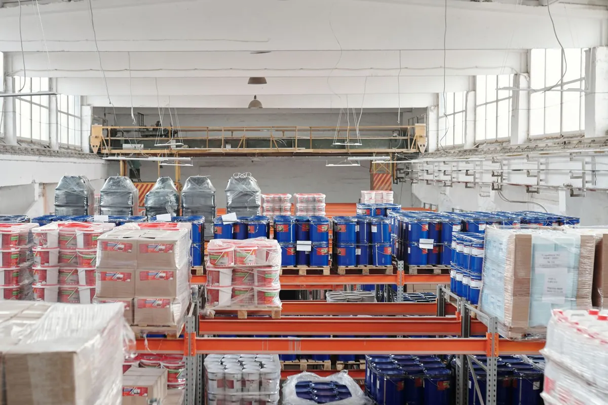 Distribution warehouse with palletised goods stored on steel racking
