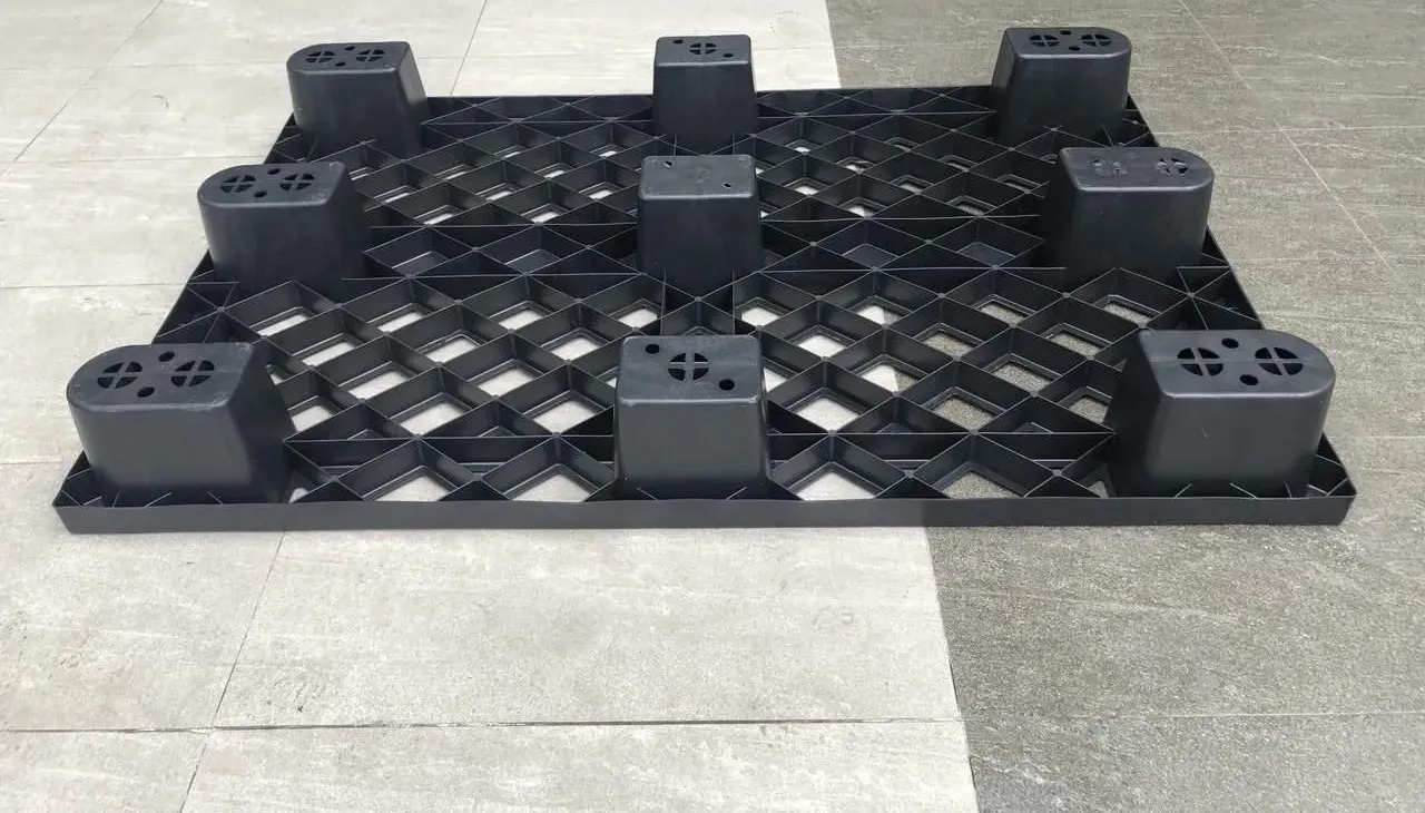 Underside of a black cup-foot plastic pallet with 9 hollow inverted-cup feet and reinforcing ribs