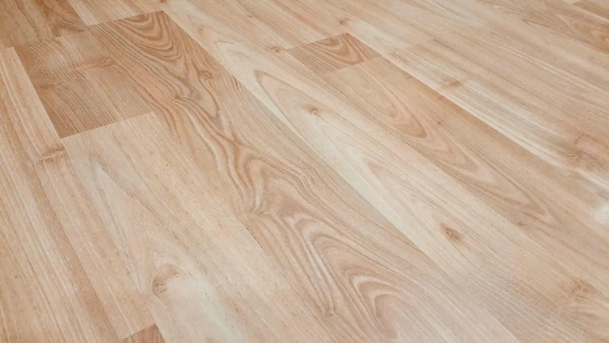Light-colored natural wood flooring with clear grain